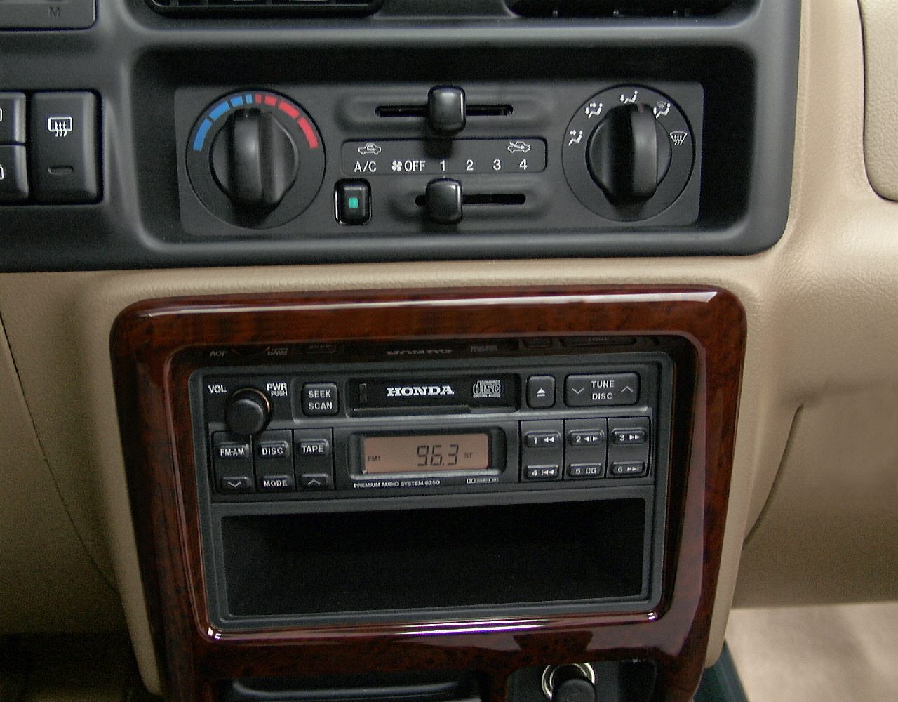 Dashboard audio system and climate control panel with wood trim