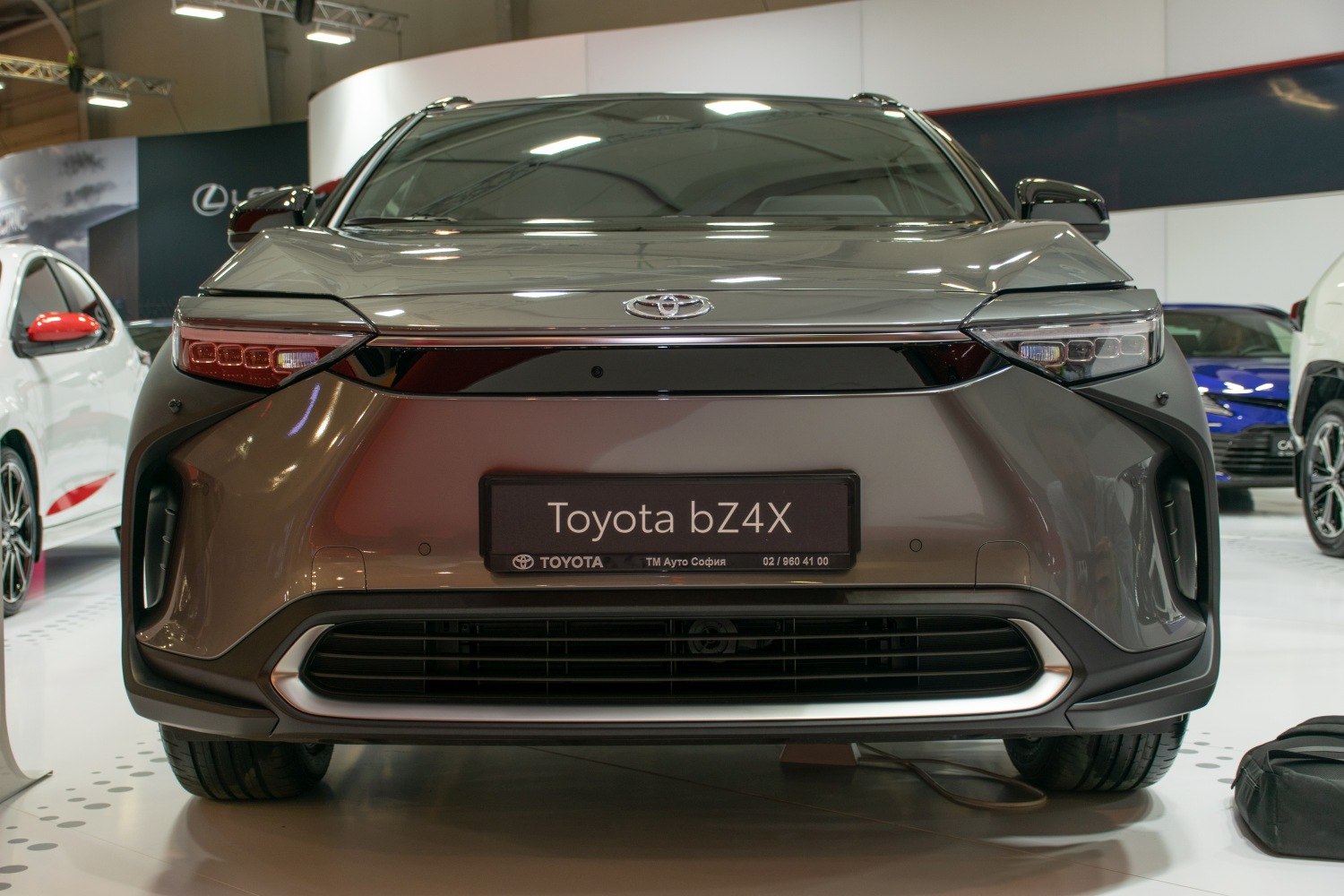 Front view of an electric SUV with sleek LED headlights and aerodynamic design