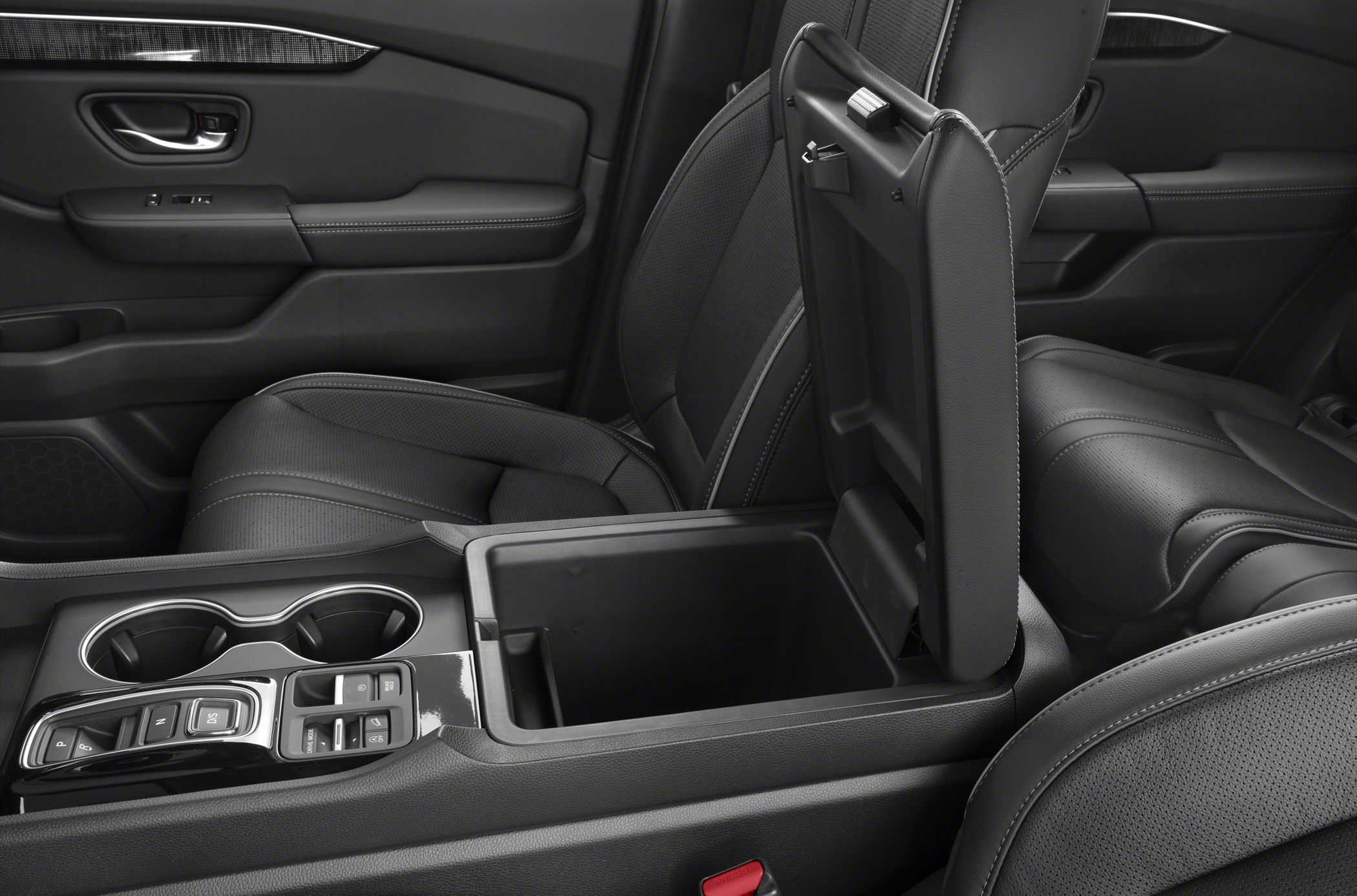 Center console storage with modern controls and leather seating