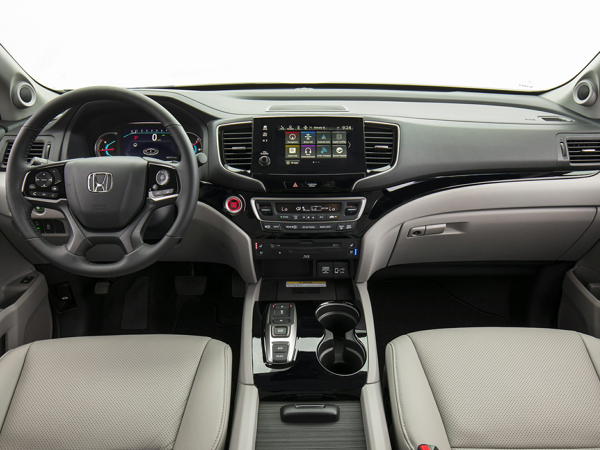 Dashboard, touchscreen infotainment, steering wheel, and center console layout