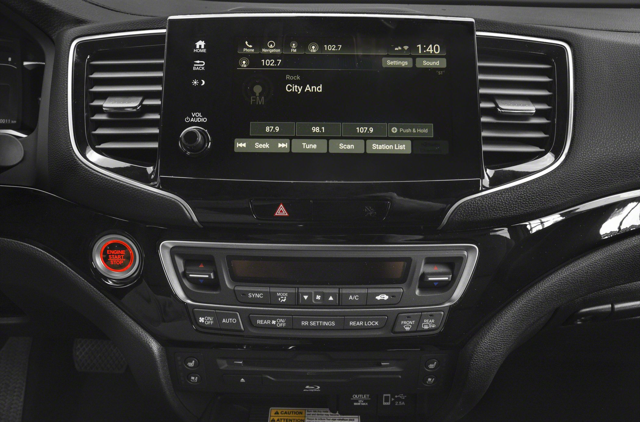 Touchscreen infotainment and climate control panel with engine start/stop button