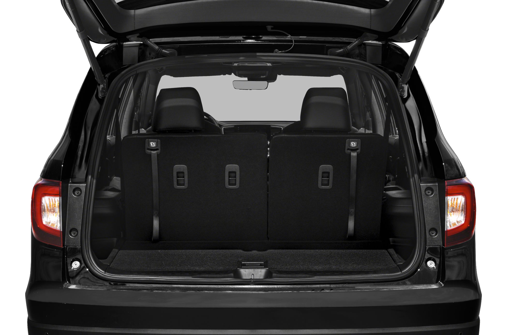 Rear cargo area featuring foldable back seats in mid-size SUV