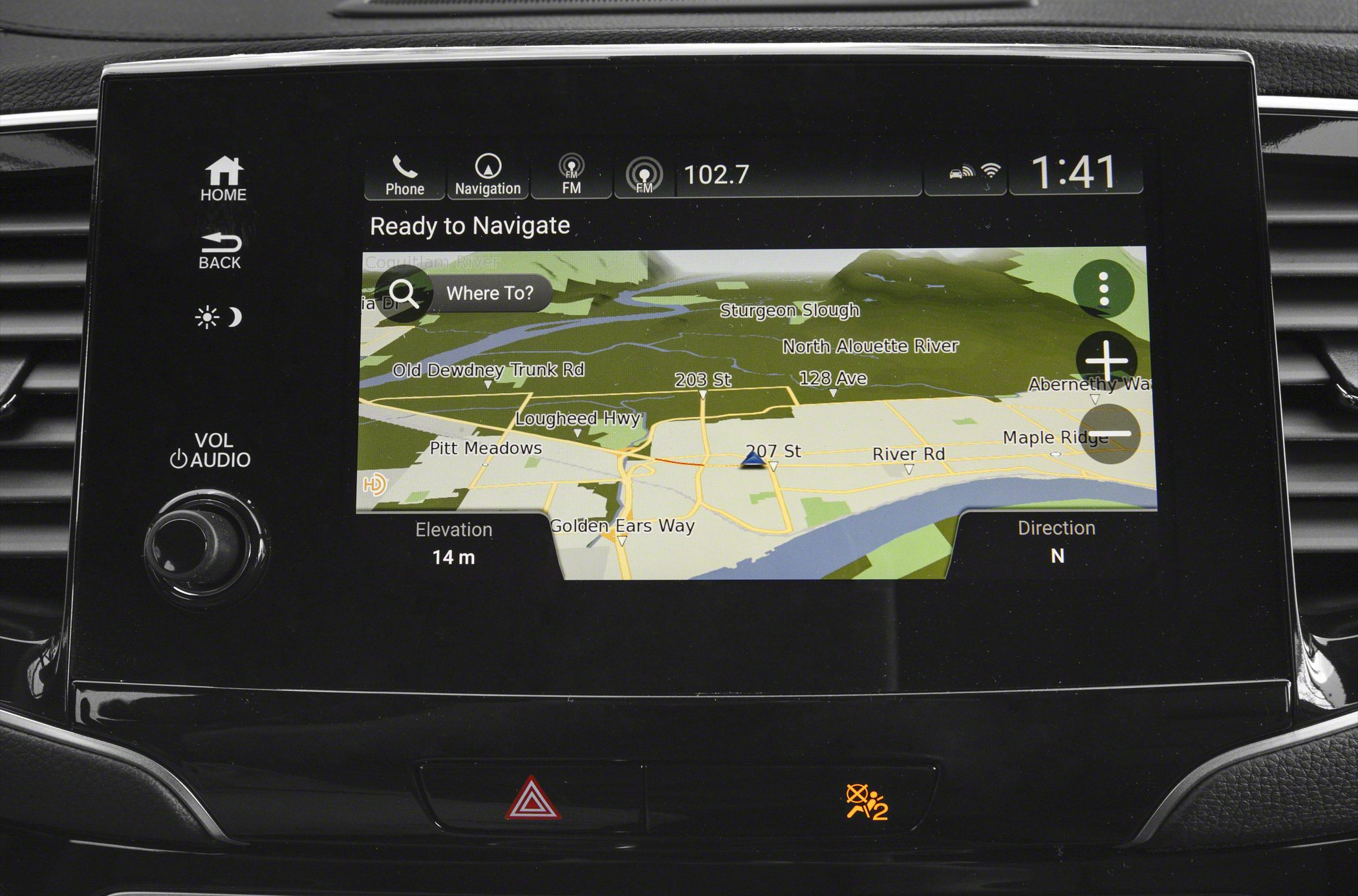 In-car navigation screen with map and media controls
