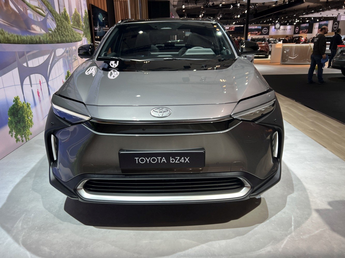 Front view of electric SUV with sleek grille and LED headlights