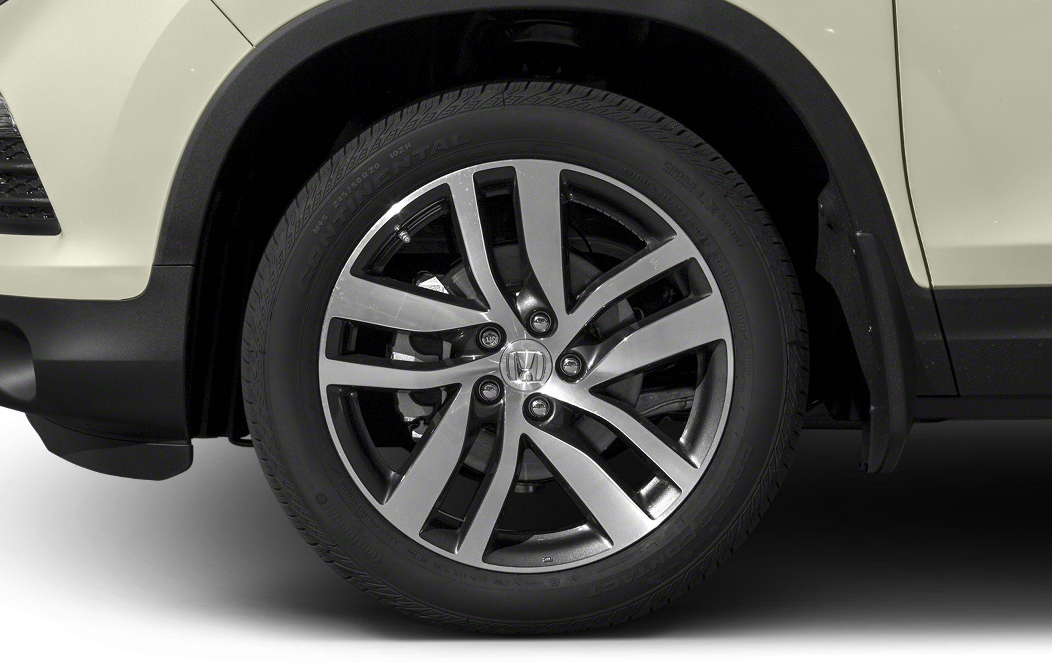 Close-up of multi-spoke alloy wheel and Continental tire