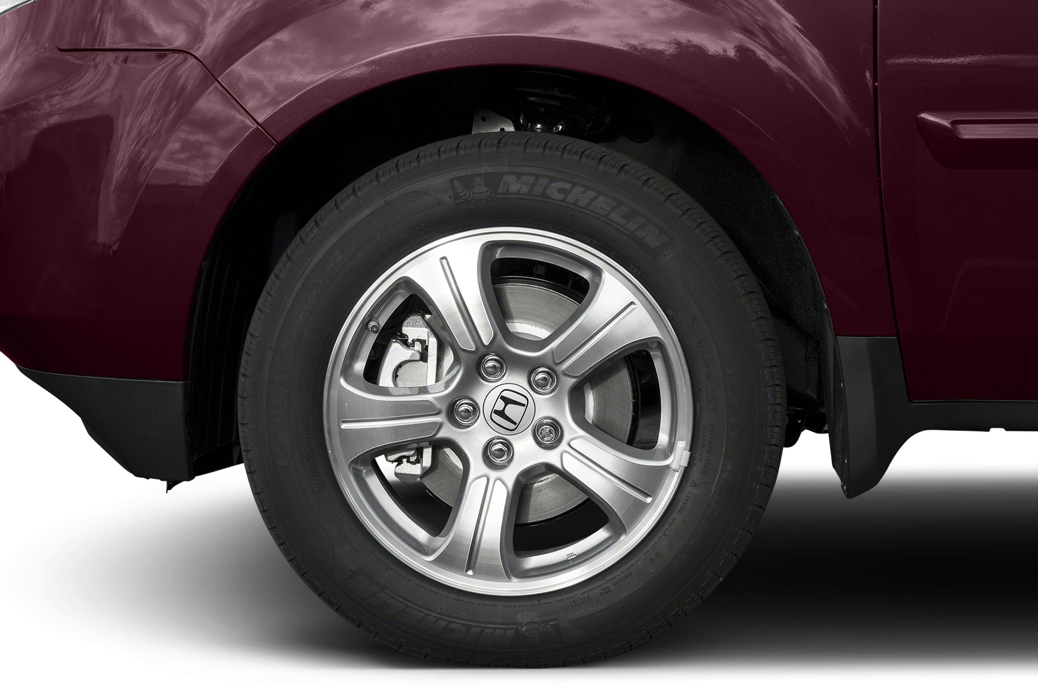 Alloy wheel and Michelin tire with brake caliper view