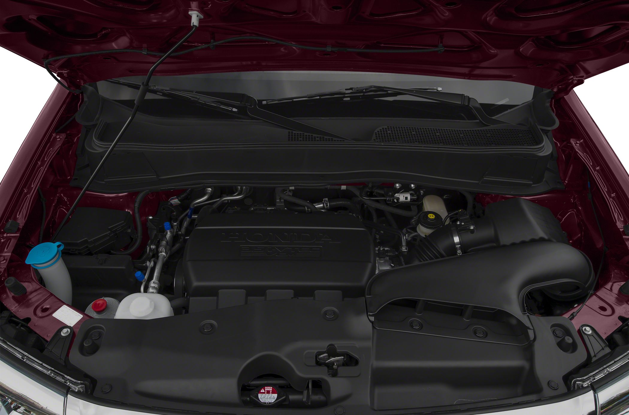 Engine bay with Honda-branded engine cover and air intake components