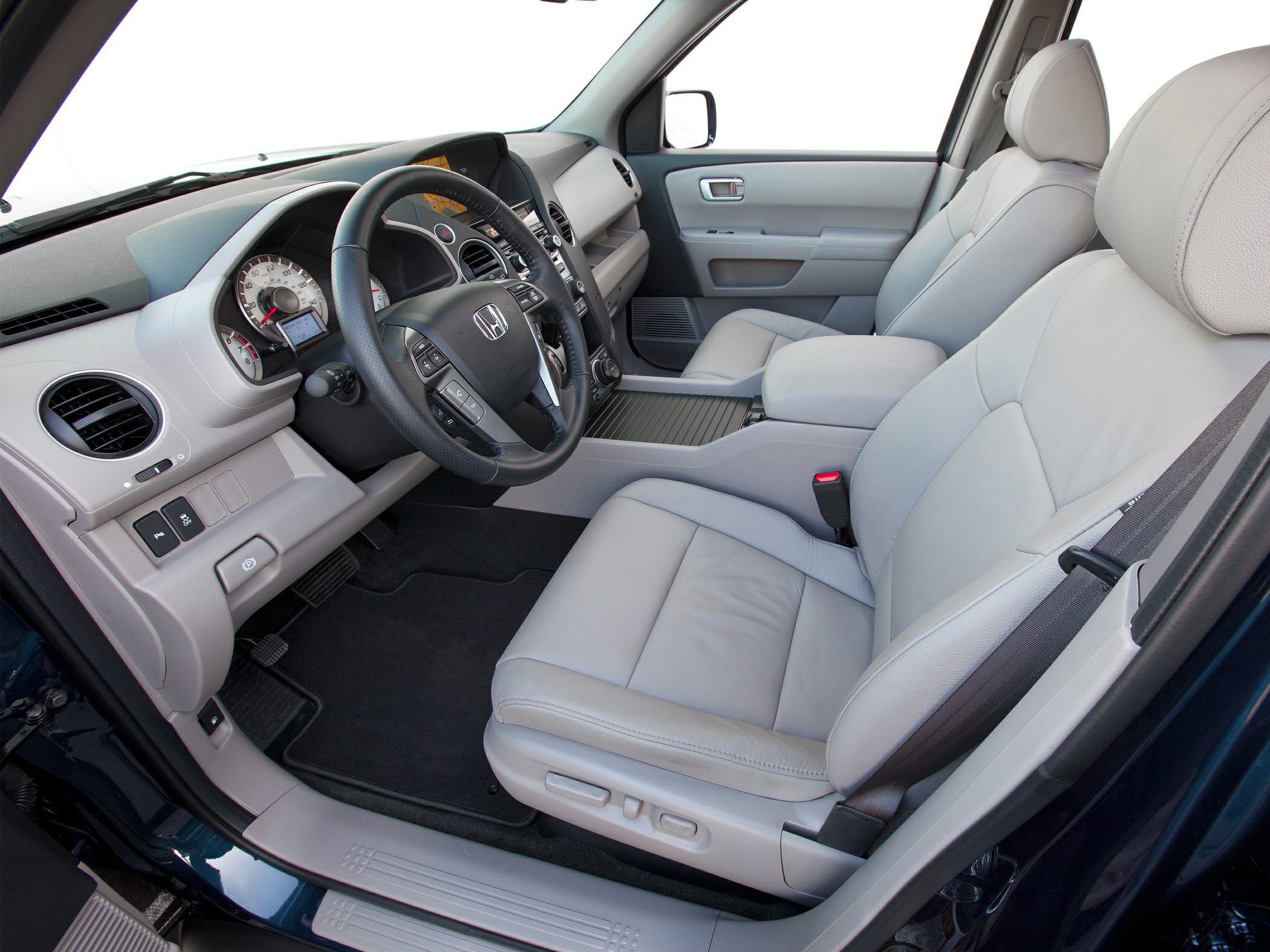 Front interior seats, dashboard, steering wheel, and center console
