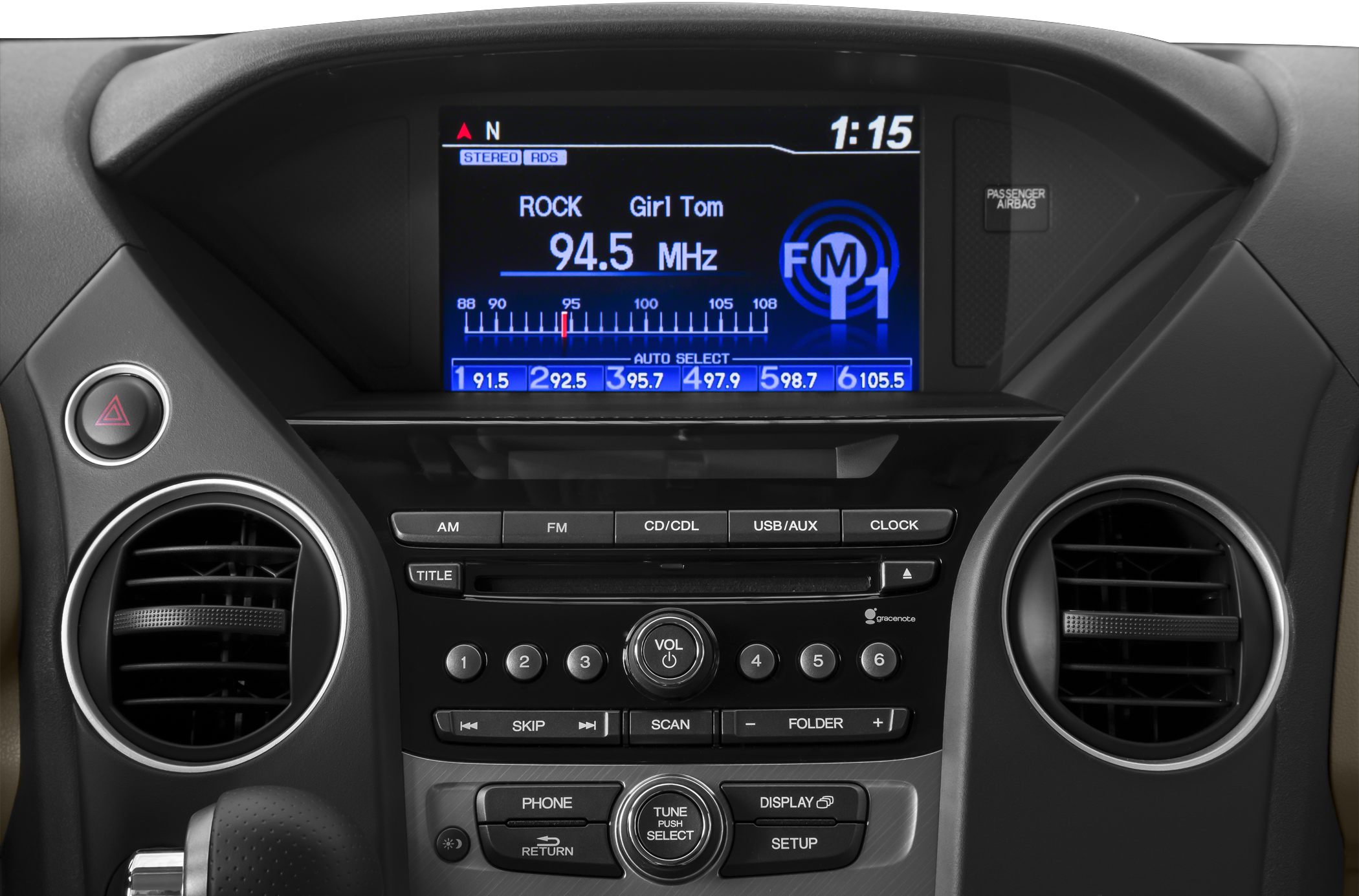 Radio display, control panel, volume and tuning knobs, circular air vents