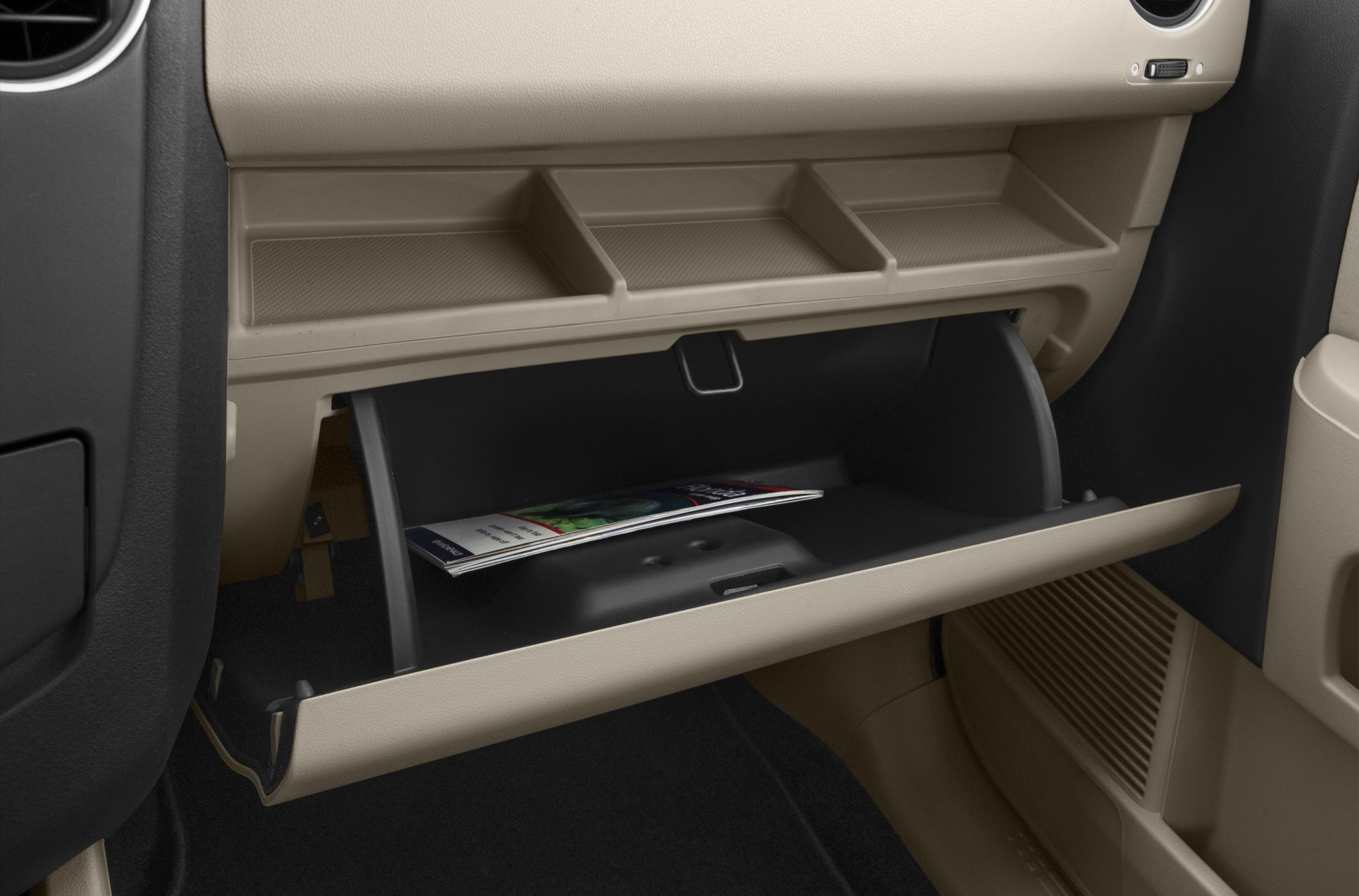 Dashboard storage compartments with open glovebox and upper tray