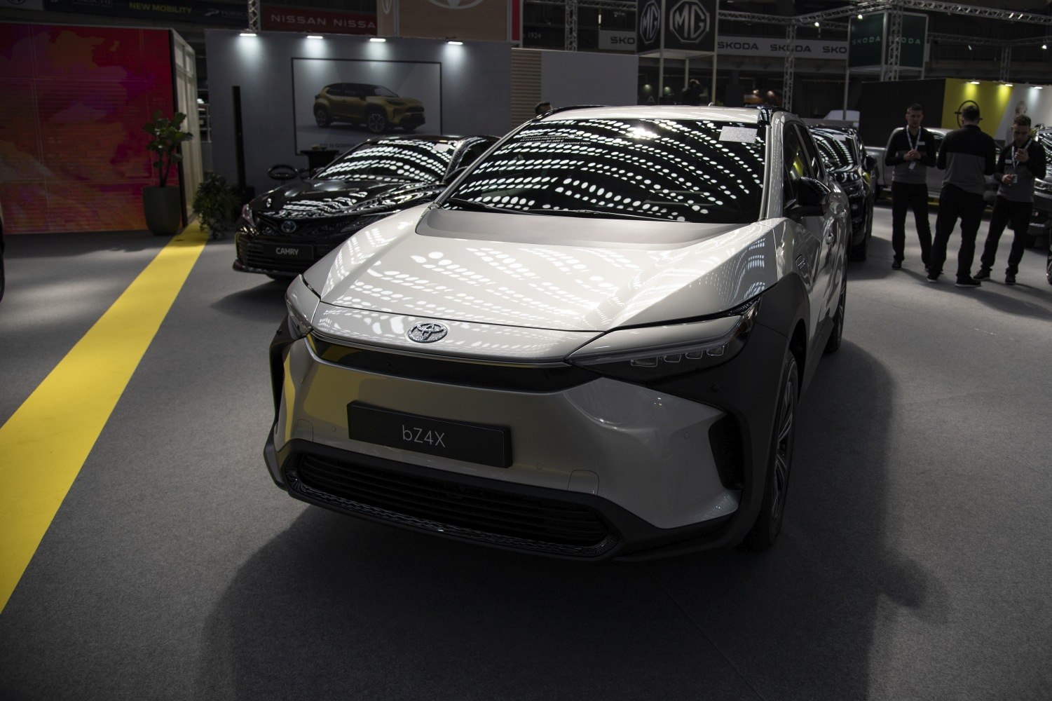 Sleek electric SUV front with sharp headlights and aerodynamic styling