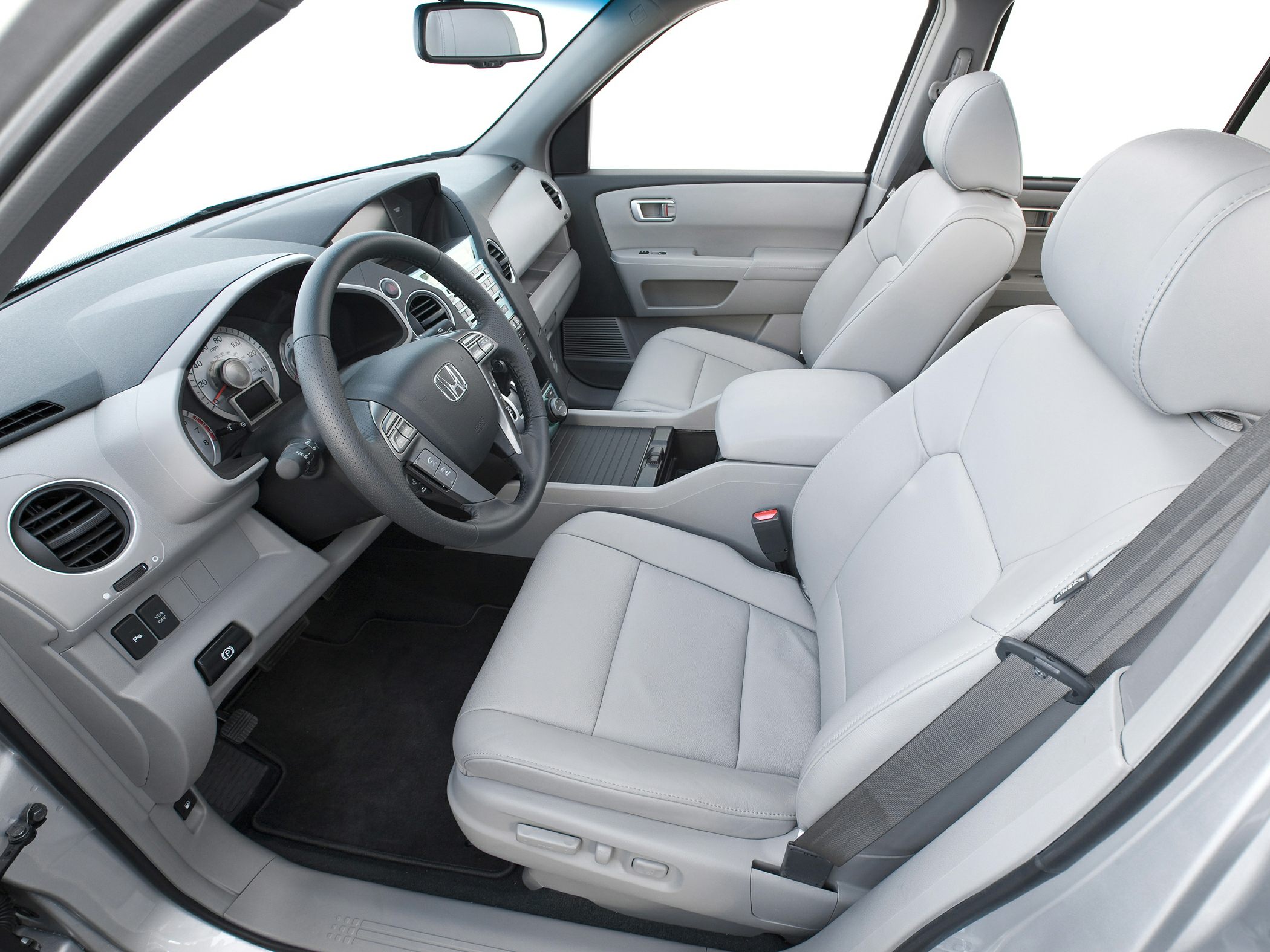 Light gray leather seats and dashboard with steering wheel