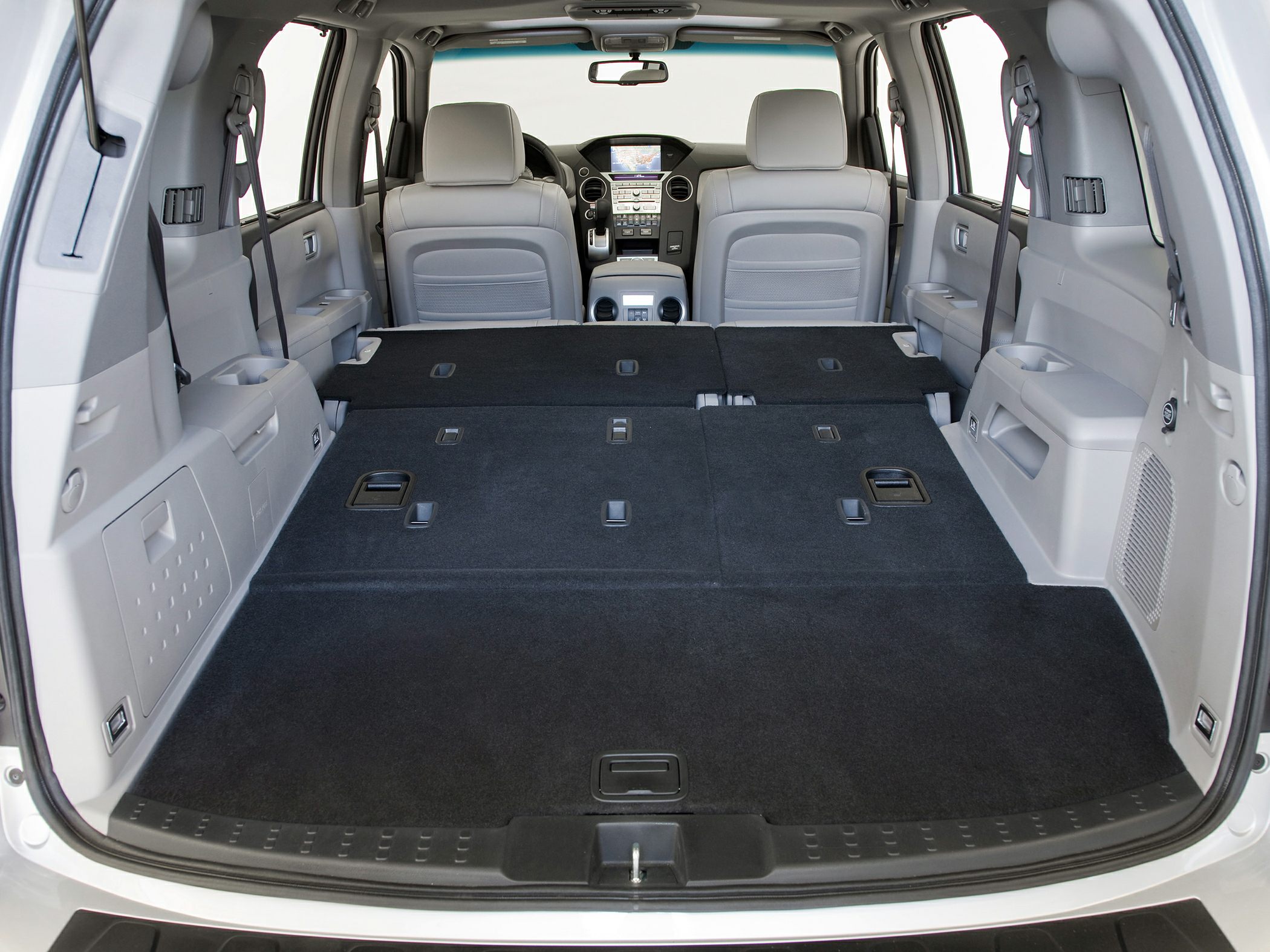 Folded rear seats and spacious cargo area in SUV interior