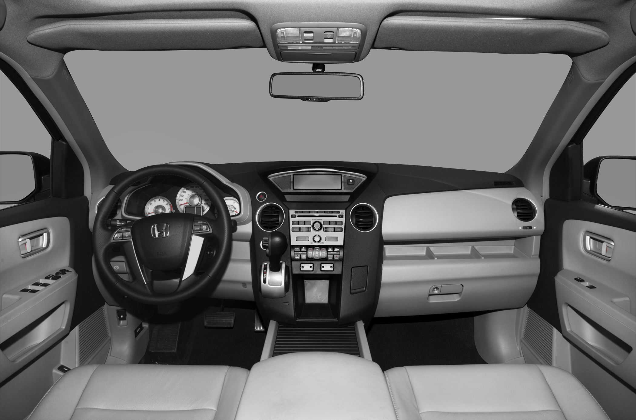 Dashboard and steering wheel with controls and gear shift