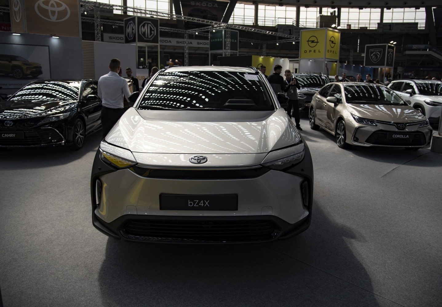 Front view of a sleek electric SUV with modern LED headlamps