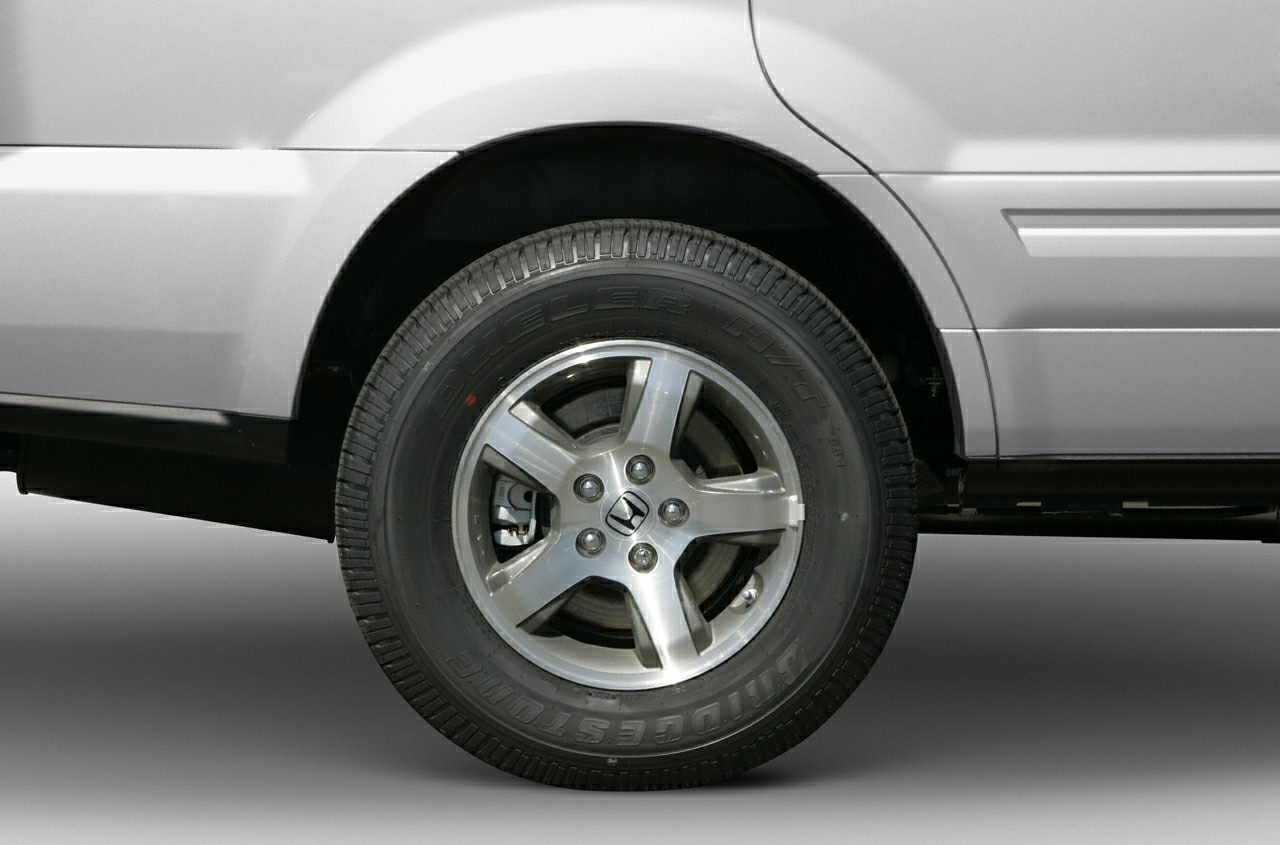 Alloy wheel and Bridgestone tire close-up on SUV