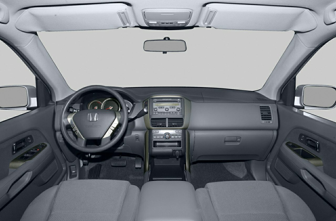Dashboard and steering wheel with center console and controls