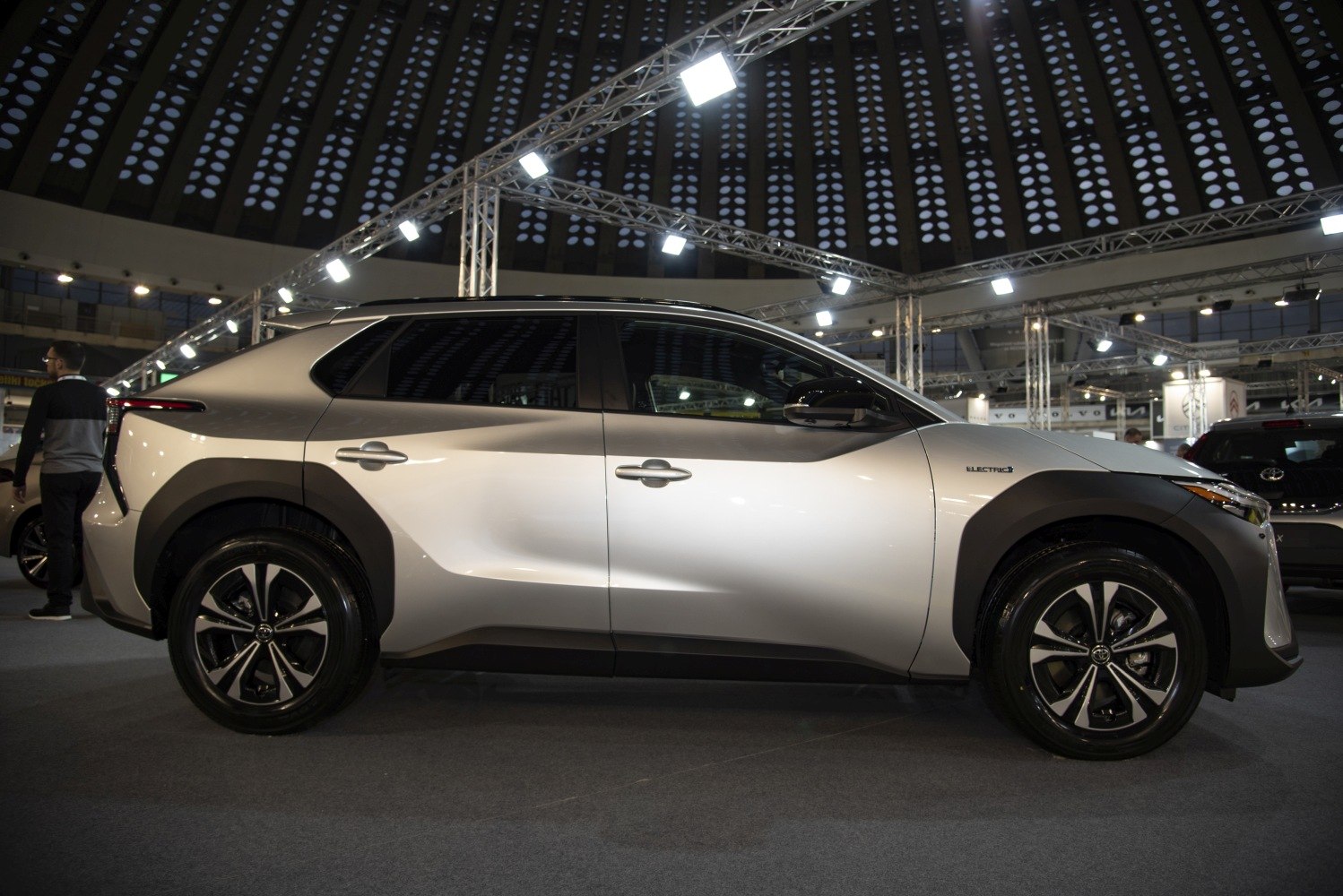 Side profile of electric SUV with distinct modern design and electric badge