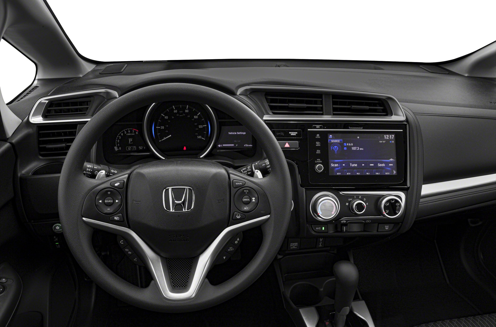 Dashboard and steering wheel with integrated controls and infotainment system.
