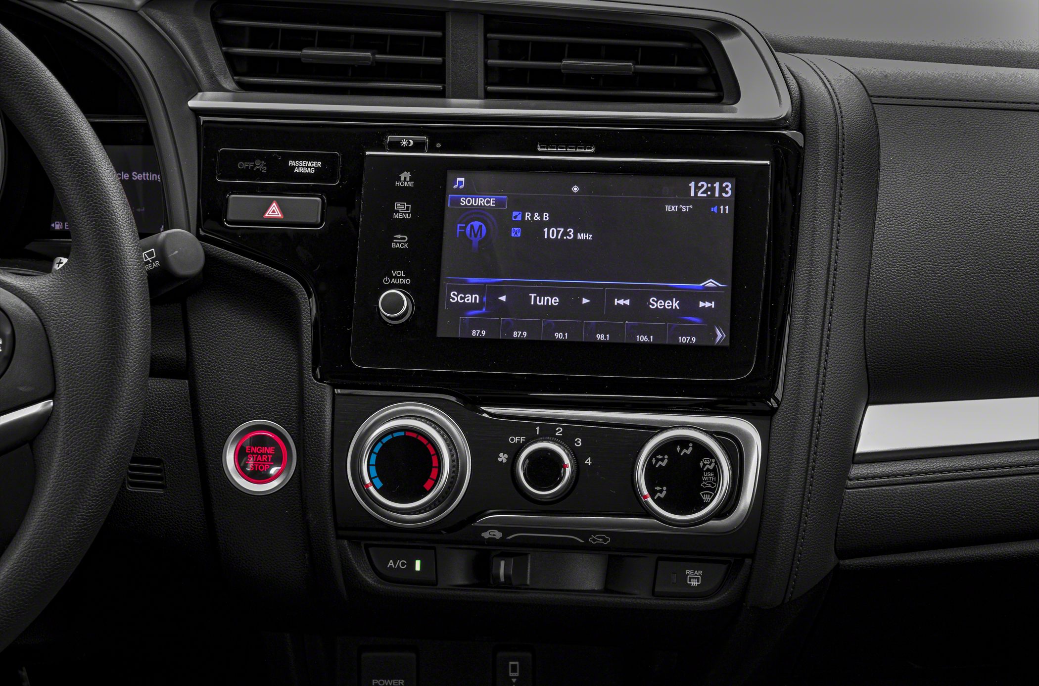 Touchscreen infotainment and manual climate control with engine start button