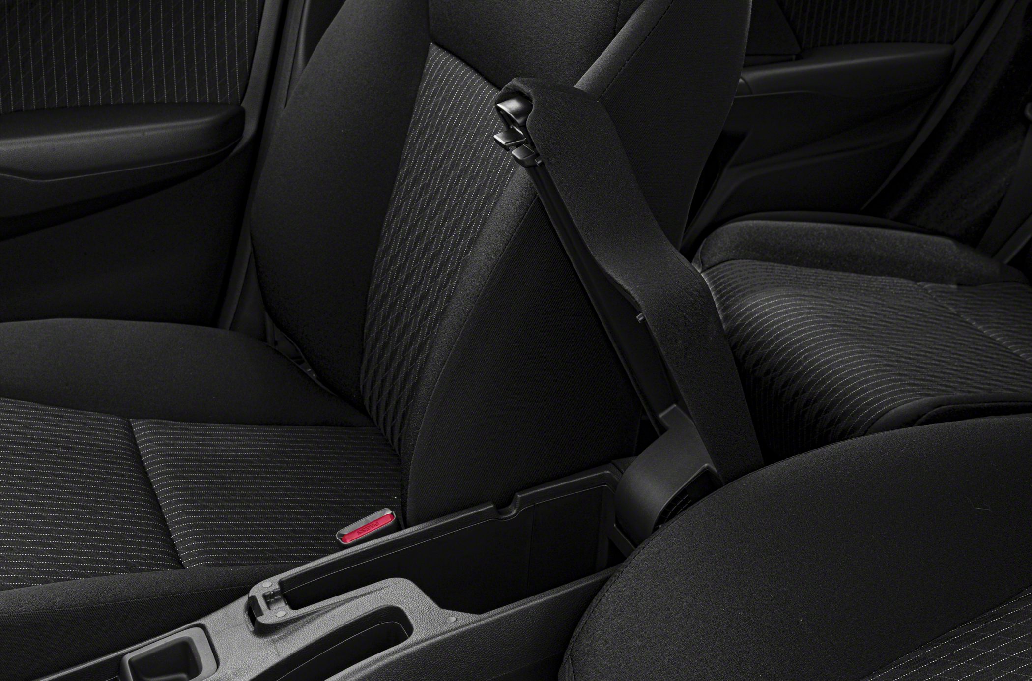 Fabric seats and center console with storage compartment.