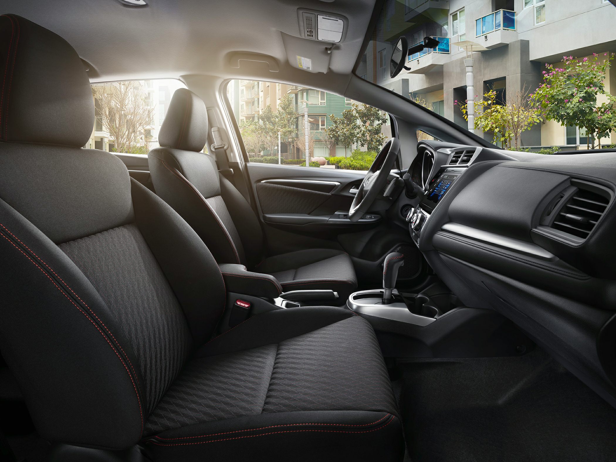 Front seats, center console, and dashboard interior view