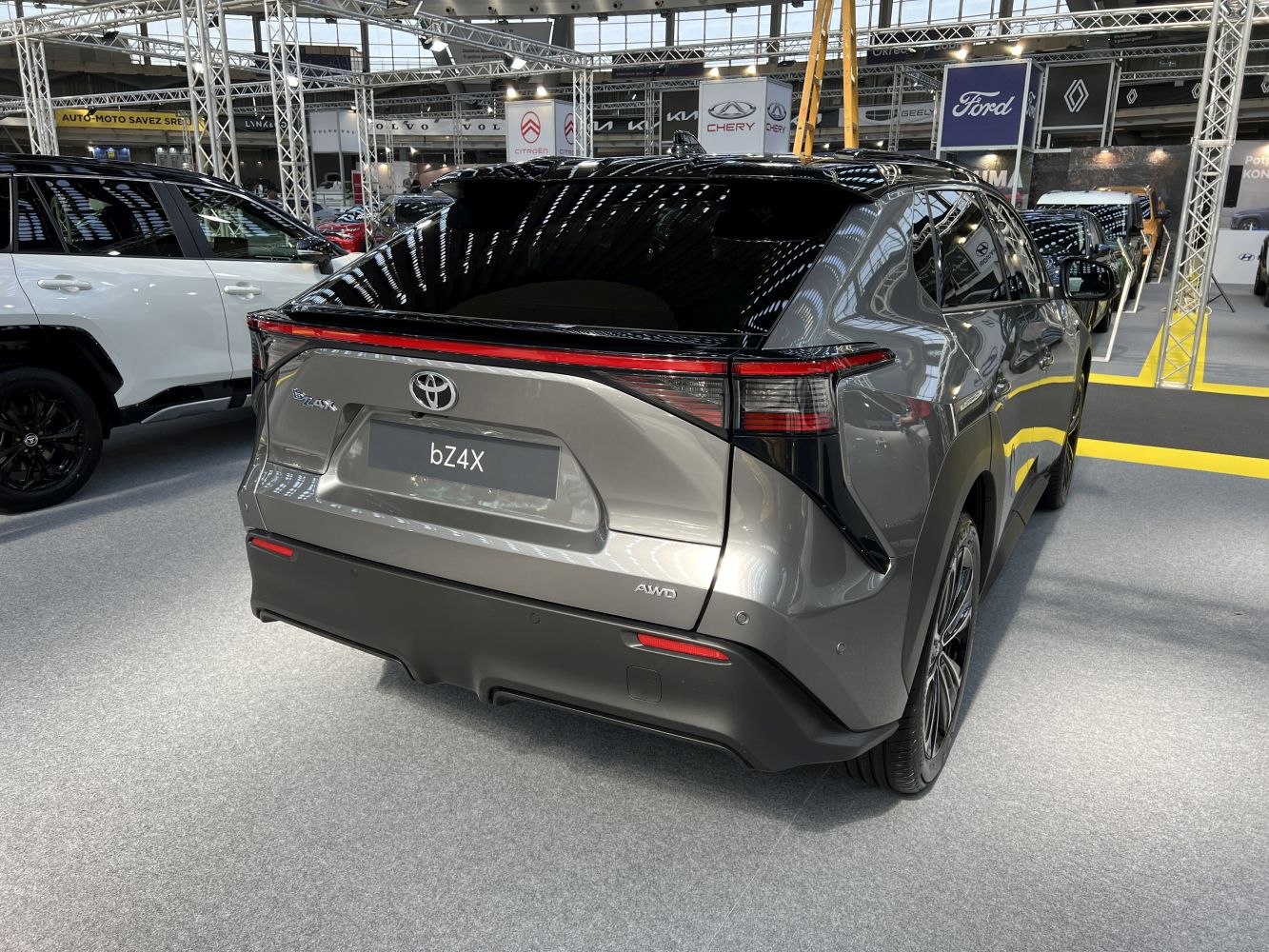 Sleek rear design with full-width taillight and AWD badge.