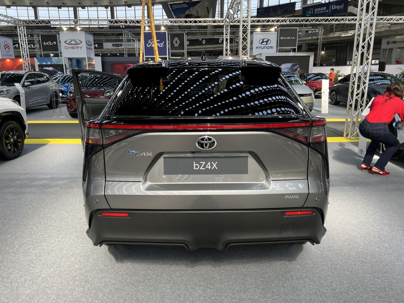 Rear view of a modern electric SUV with LED taillights and AWD badge