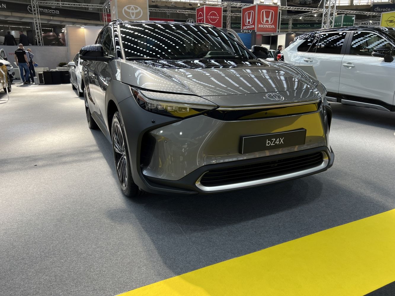 Electric SUV front view with sleek LED headlights and modern design