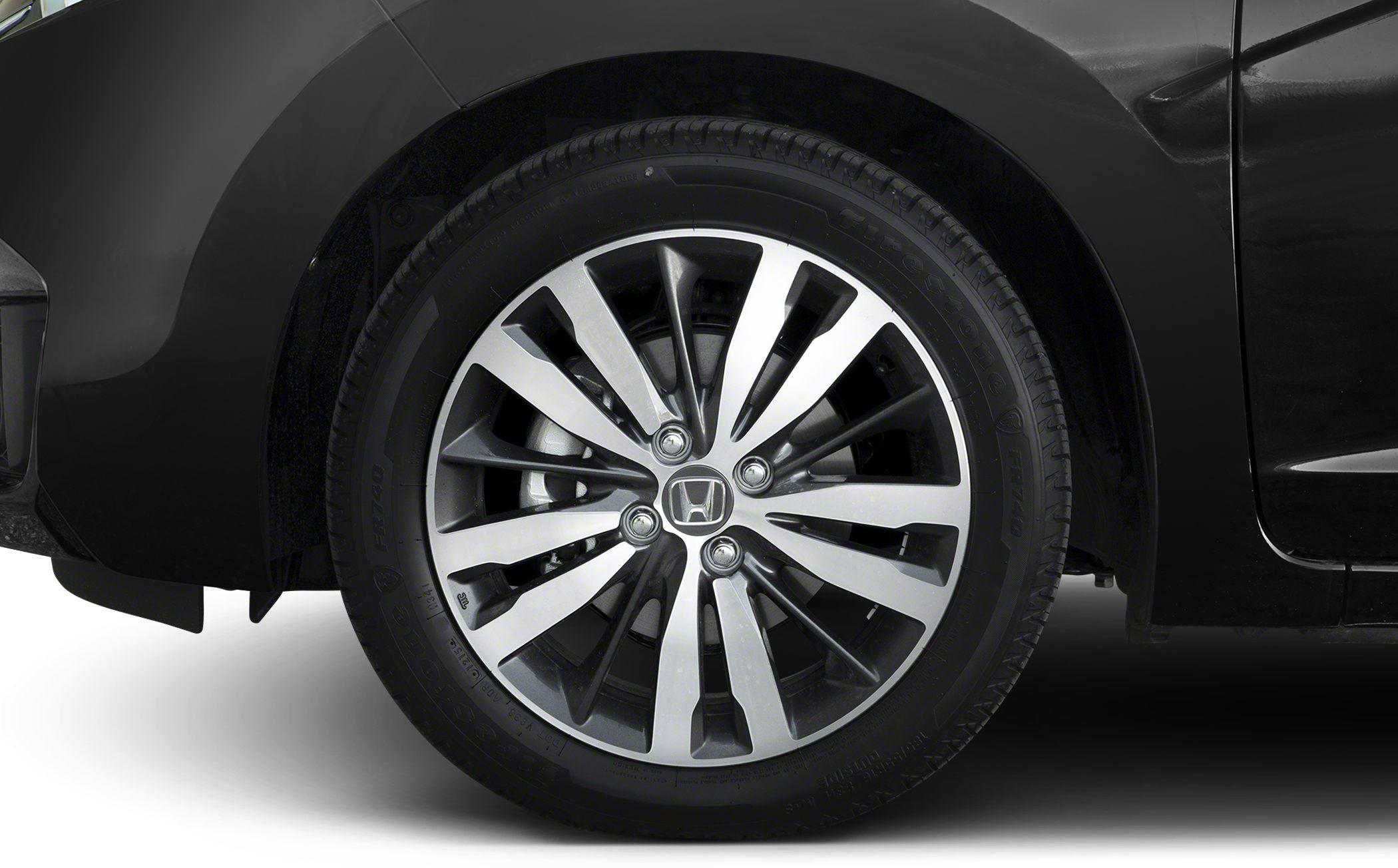 Close-up of multi-spoke alloy wheel and tire tread