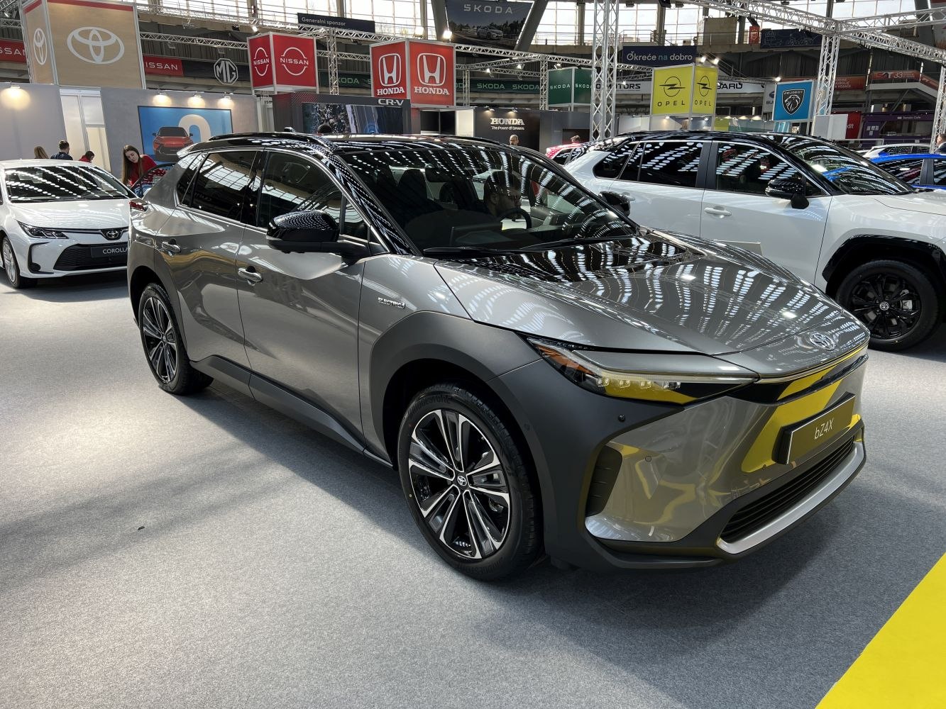 Front three-quarter view of a modern electric SUV with sleek aerodynamic design.