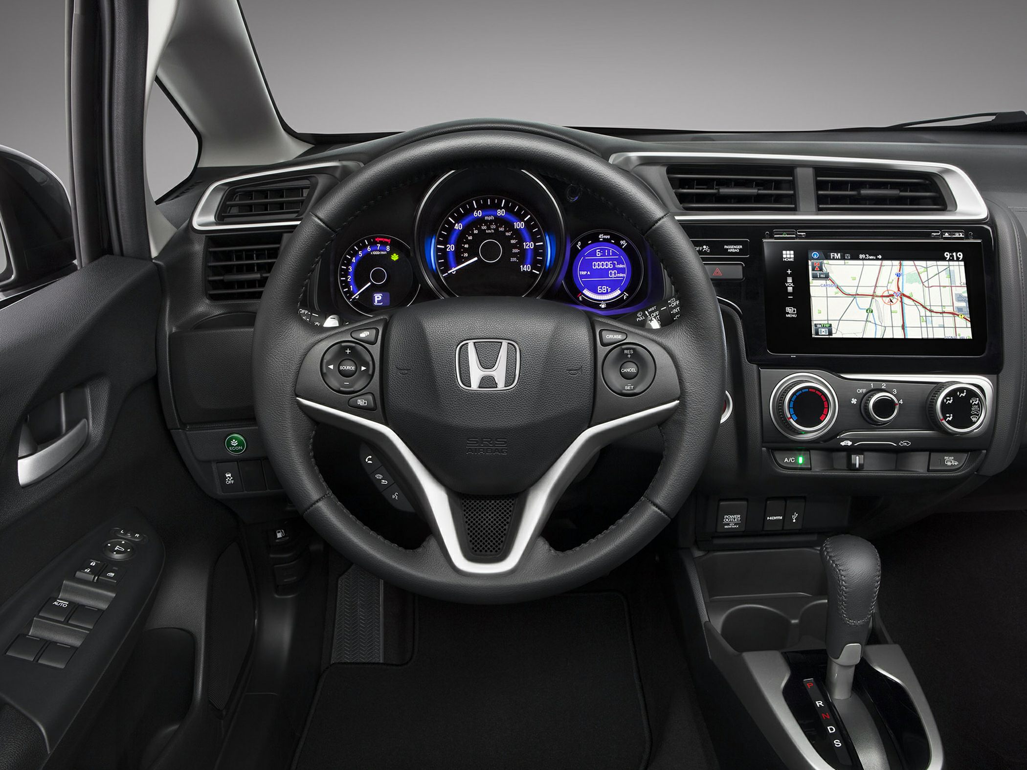 Steering wheel, digital dashboard, touchscreen infotainment, automatic transmission gear shift