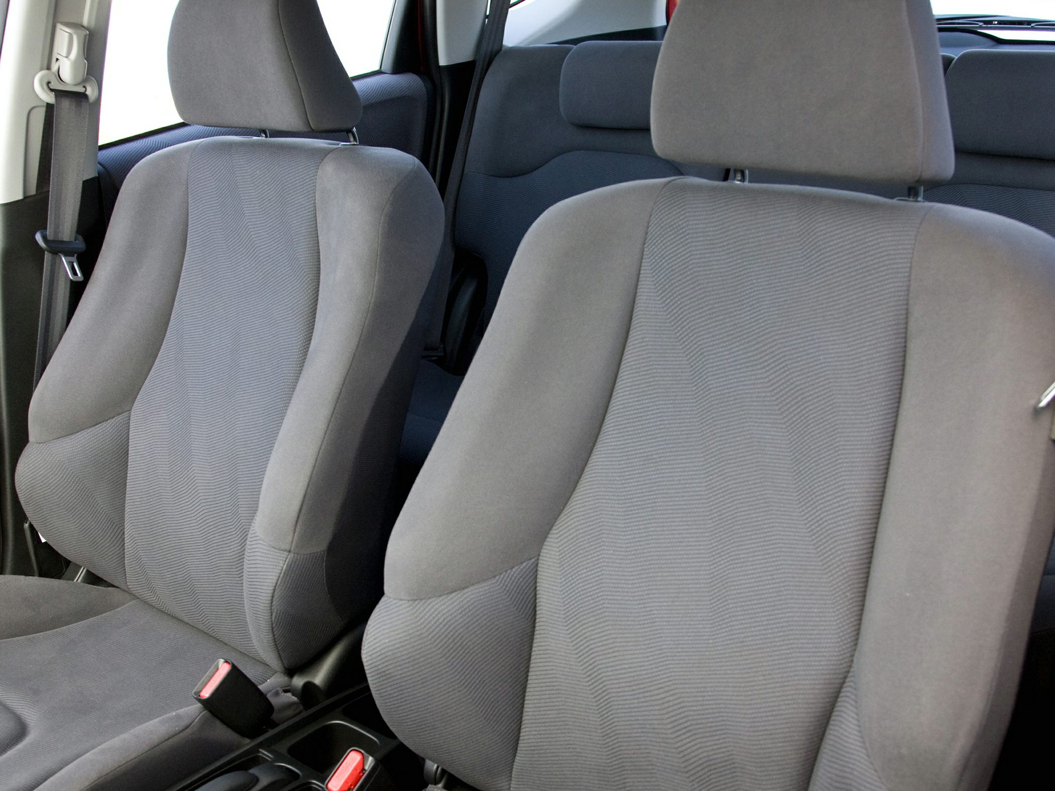 Close-up view of ergonomic fabric front seats upholstery