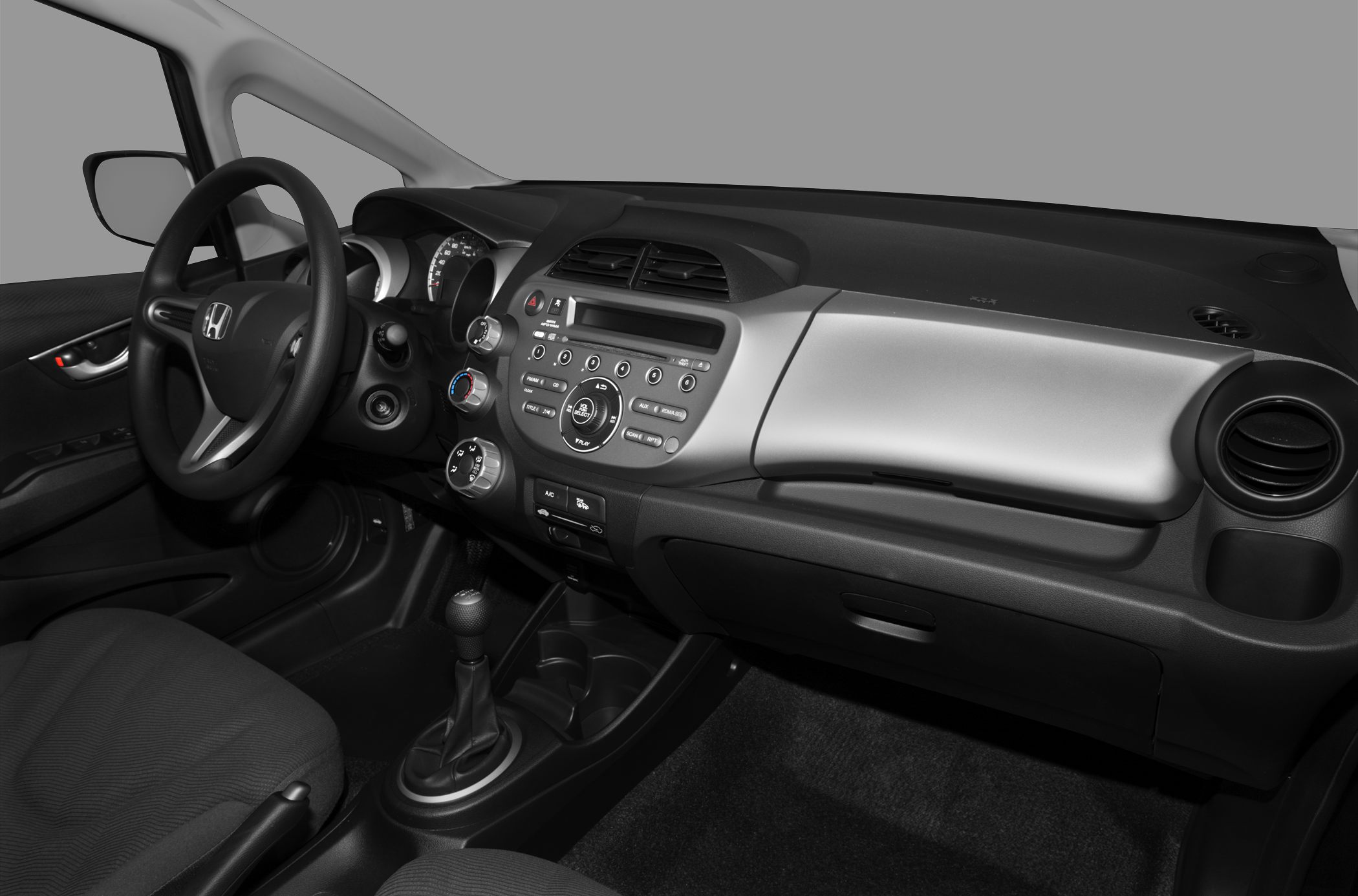 Interior dashboard and steering wheel with control panel and manual gear shift