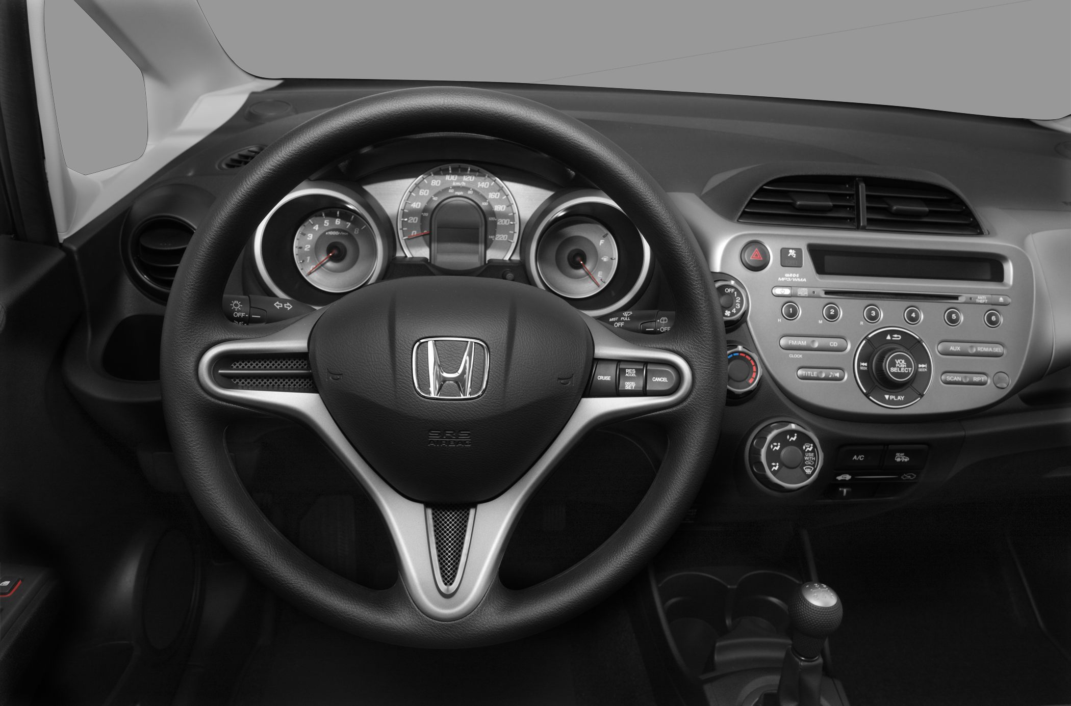 Steering wheel and dashboard with instrument cluster and control buttons