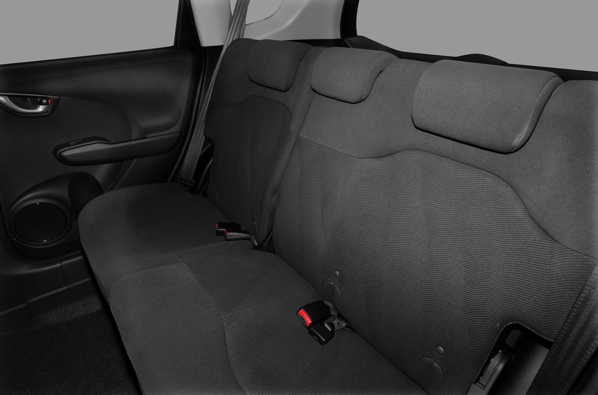 Compact hatchback rear seat with fabric upholstery and seat belts
