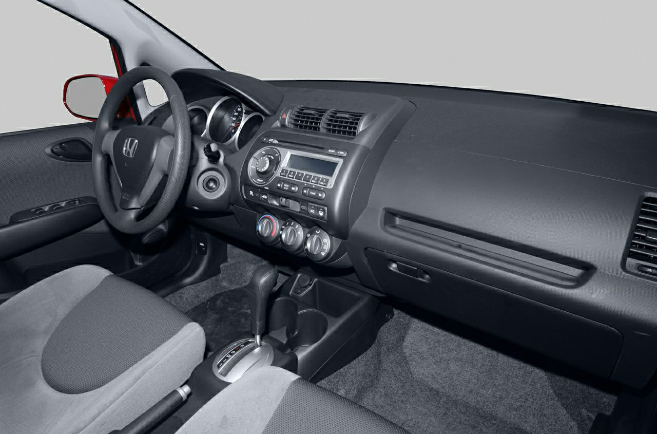 Dashboard and steering wheel with center console and climate control knobs