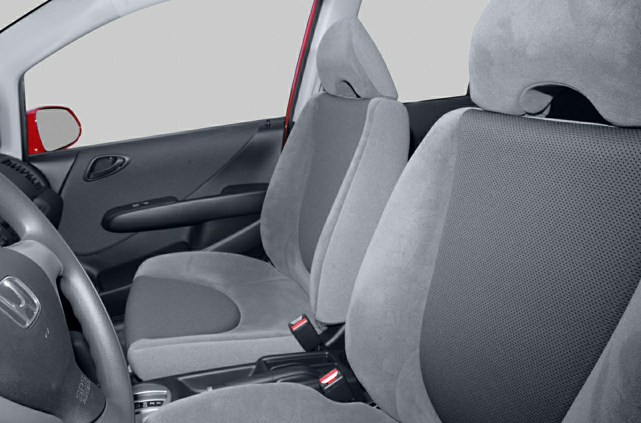 Front seats and steering wheel of a 2001 compact car interior