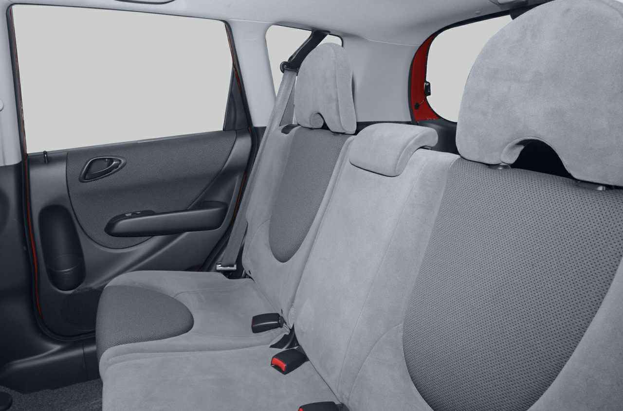 Rear seat interior with gray fabric upholstery and door panel