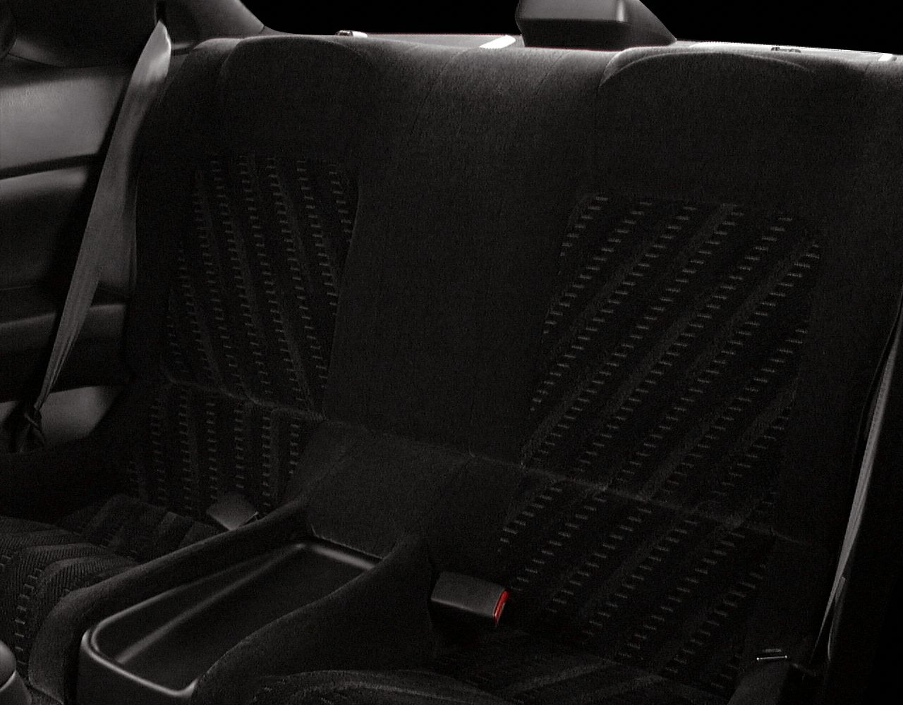 Rear seat fabric upholstery with integrated armrest and seatbelt