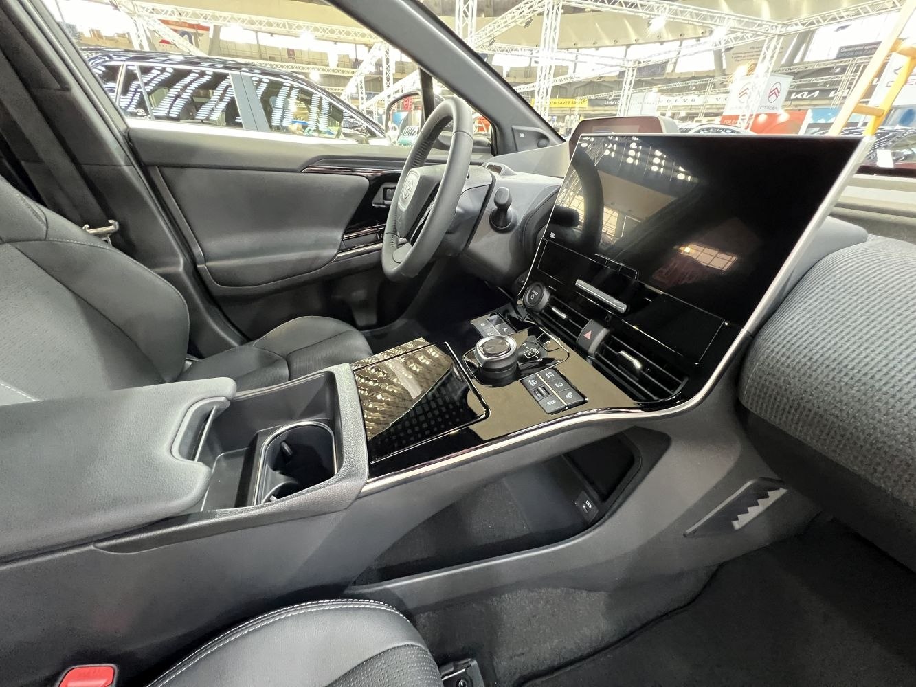 Large touchscreen and modern center console with digital controls