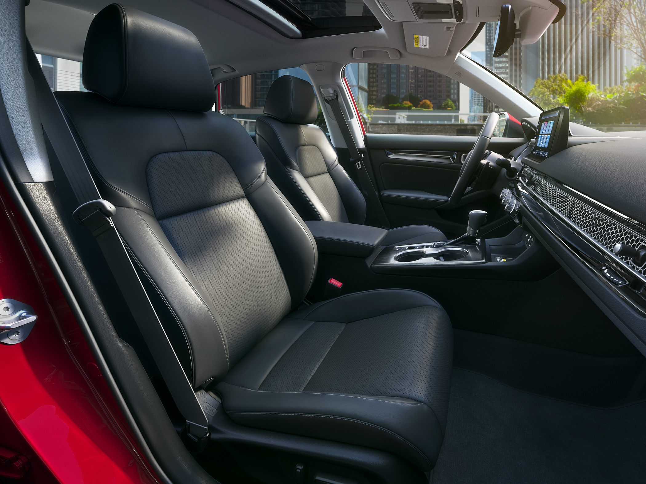 Premium leather seats with modern dashboard and touchscreen infotainment