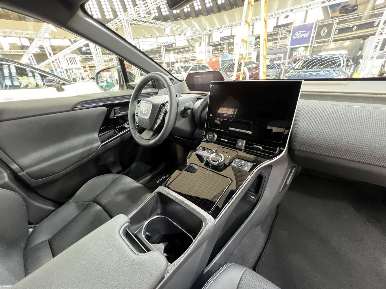 Modern dashboard with digital displays and ergonomic controls