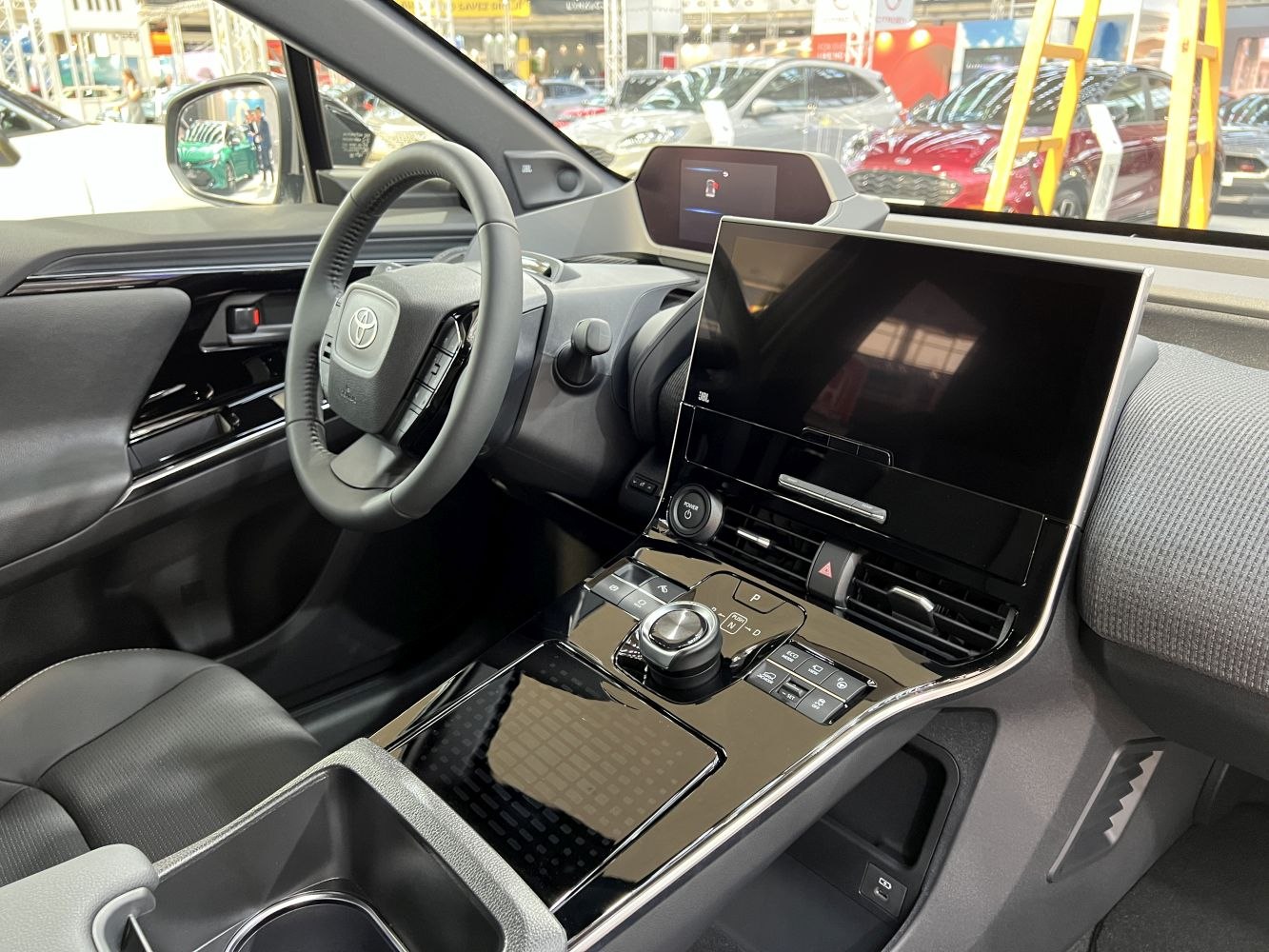 Large touchscreen and rotary control knob in vehicle interior