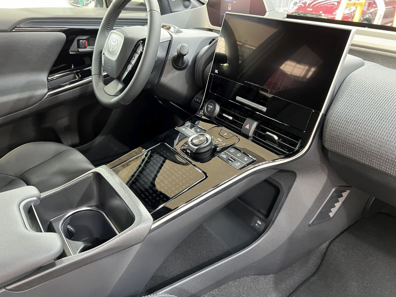 Modern center console and dashboard with infotainment screen and gear selector knob