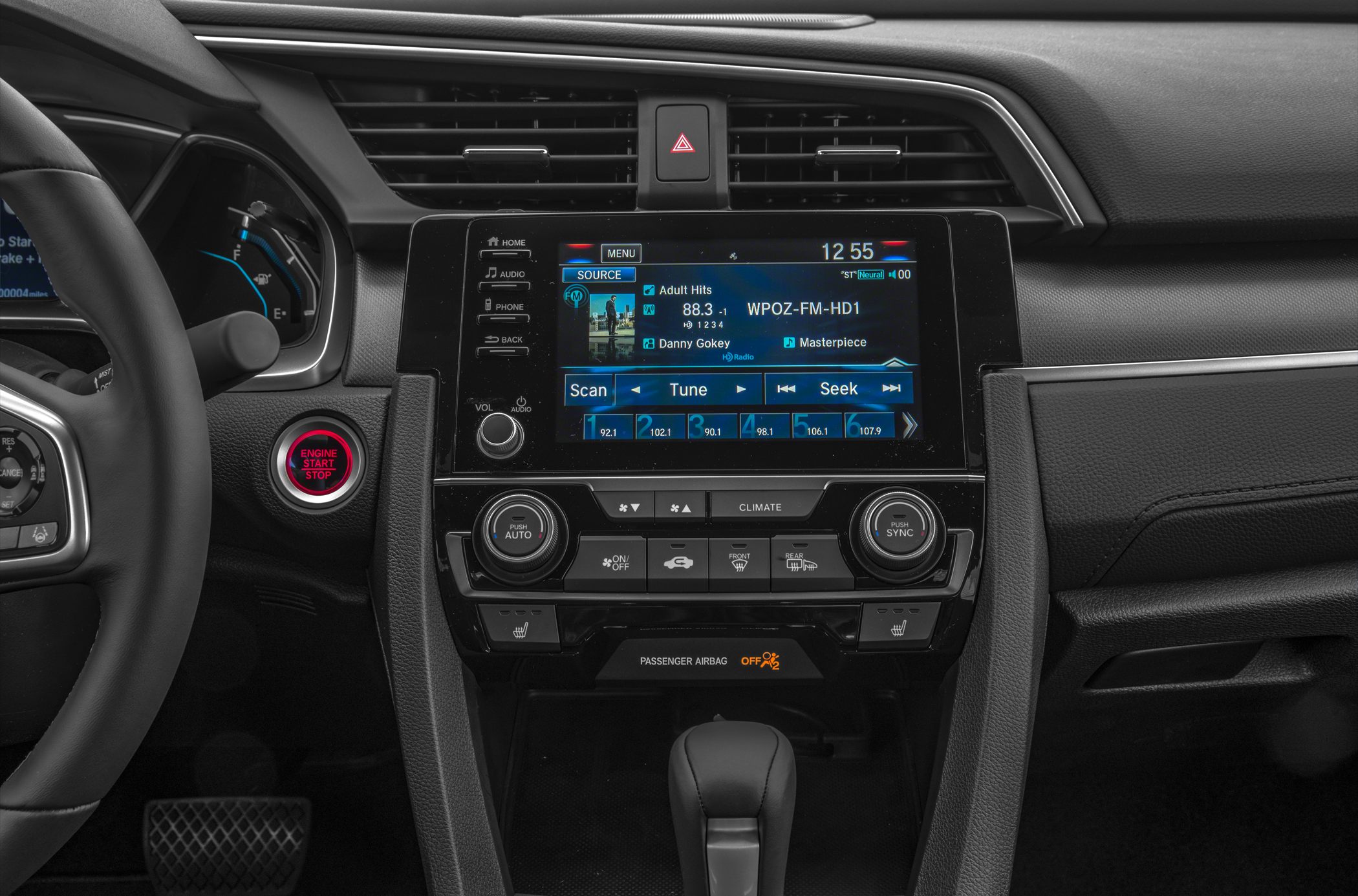 Dashboard and infotainment system with climate control and engine start button