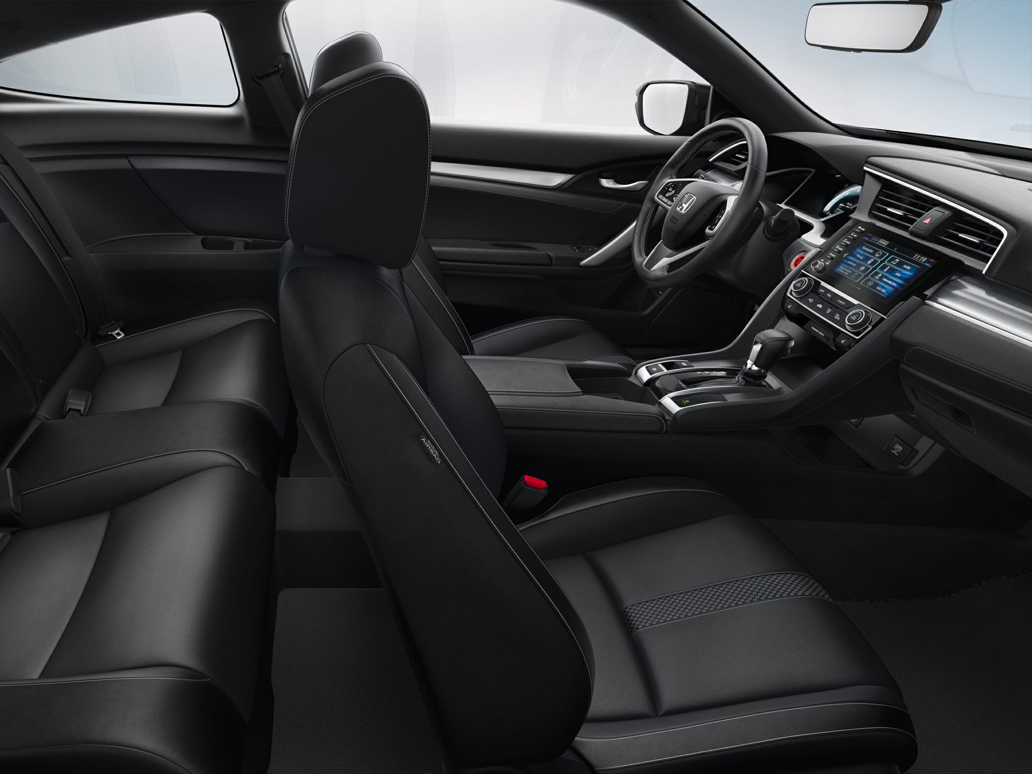 Black leather seats and modern dashboard with touchscreen