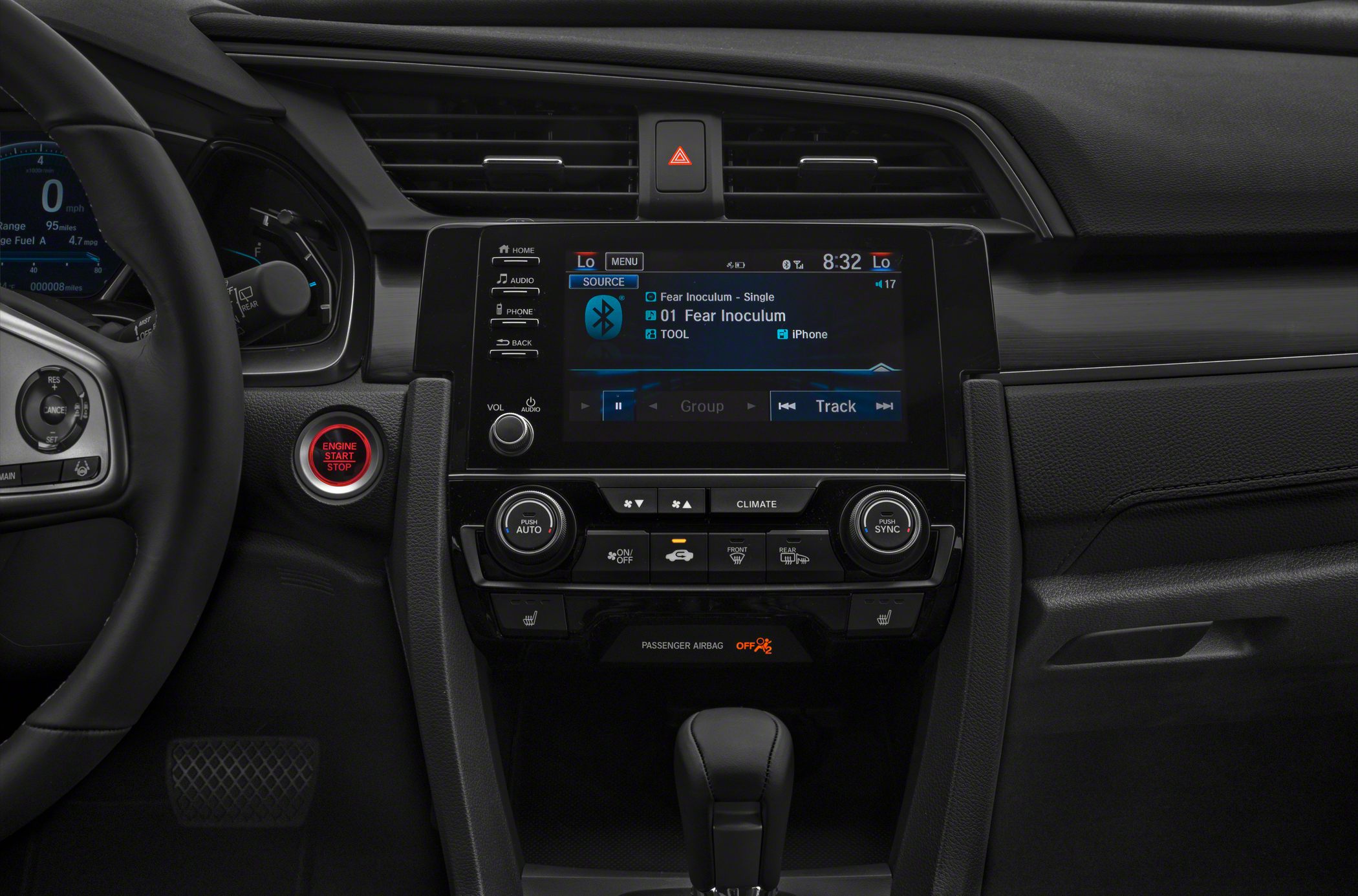 Infotainment touchscreen and dual-zone climate control in a modern dashboard