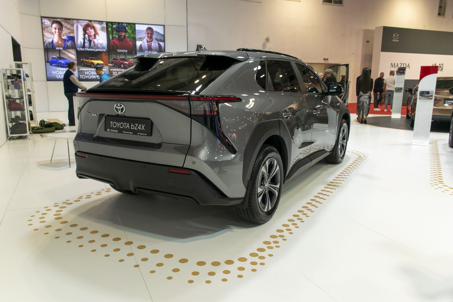 Rear view of electric SUV with sleek tail lights and aerodynamic design