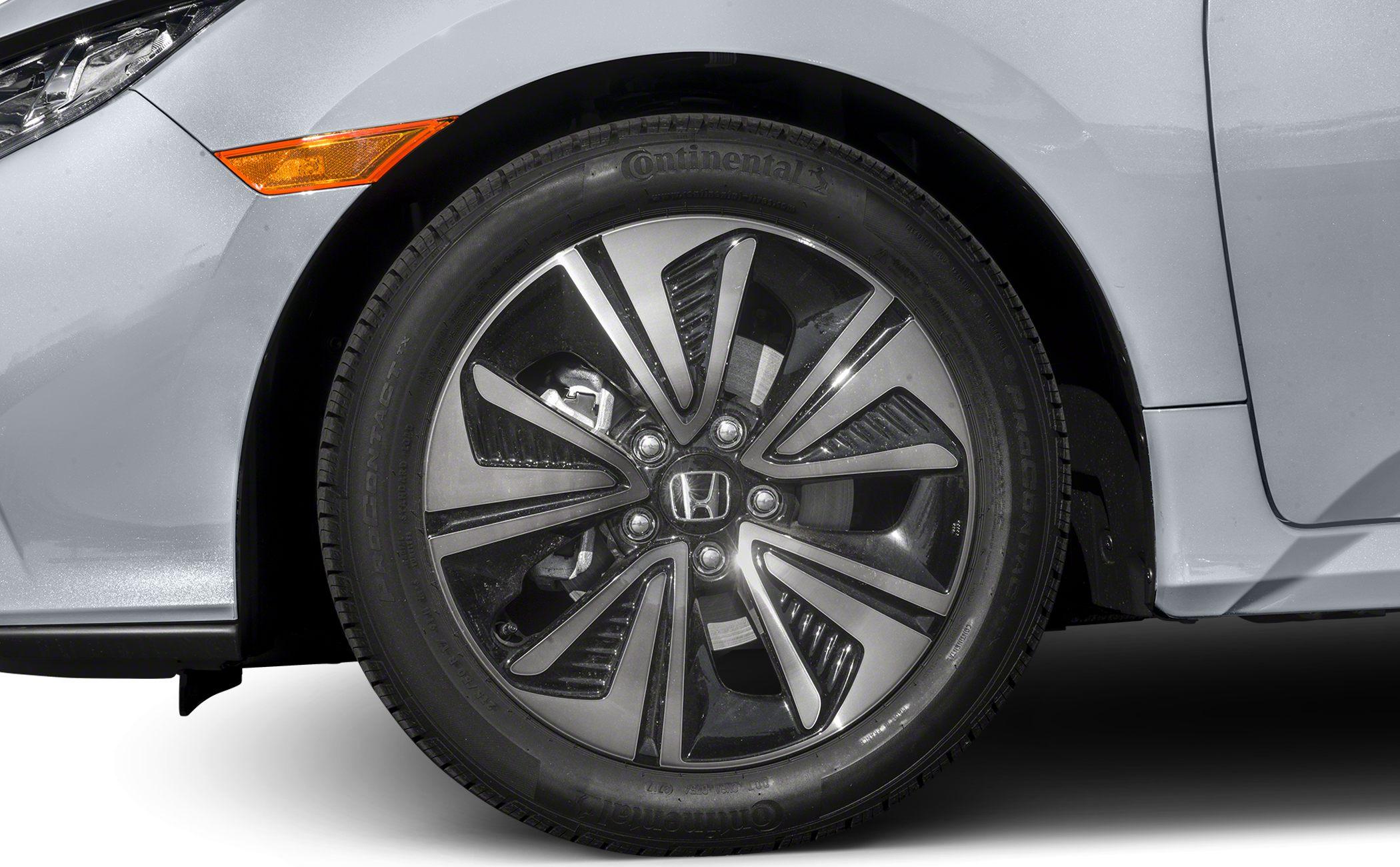 Close-up of alloy wheel with Continental tire and black-silver rim design.